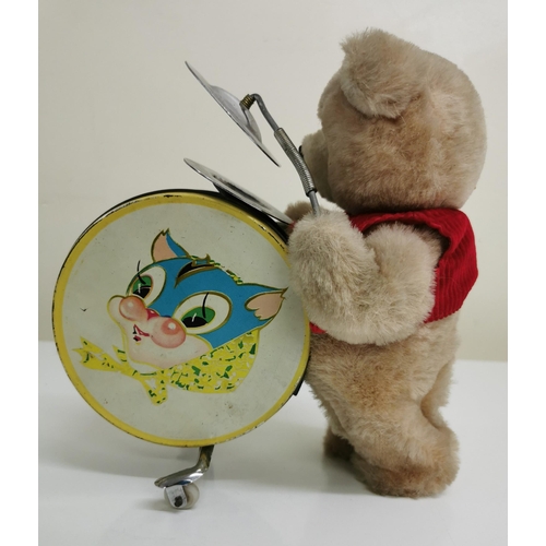 1819 - A vintage marching teddy, with mechanical drum & cymbals, c.1970's. Height 21cm. Battery powered. Un... 