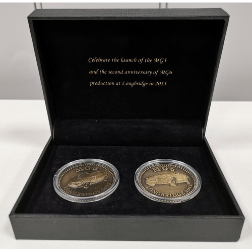 1844 - A selection of six branded/commemorative MG Items. To include a stainless-steel watch, two coins, bo... 