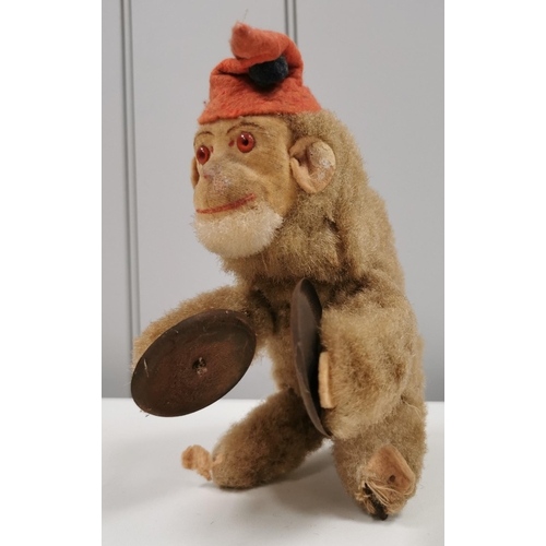 1901 - A vintage, likely West German, clockwork cymbal-playing monkey from 1950's. Height approx. 16cm. Sho... 