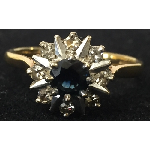 A stunning 18ct Gold dress ring, with central claw set sapphire & surrounding claw set diamonds (eight). Size P. Total weight 4.8g. Complete with a  professional insurance valuation from 2018 (valued at £1100)