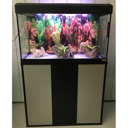 A large fish tank/aquarium on stand. Complete with 'Fluval' light