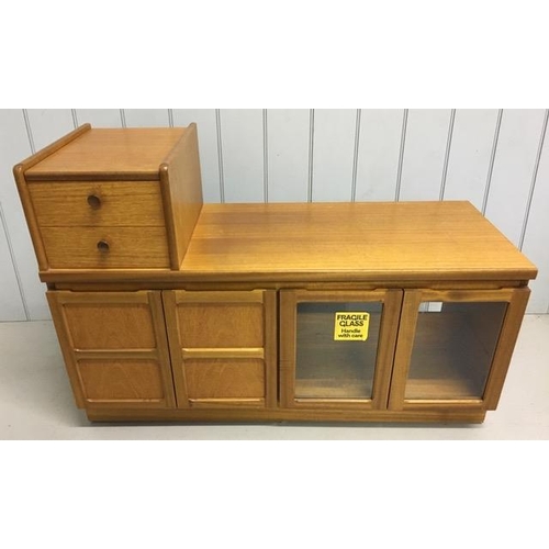 129 - A mid-century, Nathan teak entertainment unit. False drawers over two double cupboards (one glazed).... 