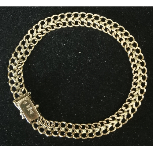A hallmarked 18ct gold bracelet, with a braided design. Weight approx. 12.5g.