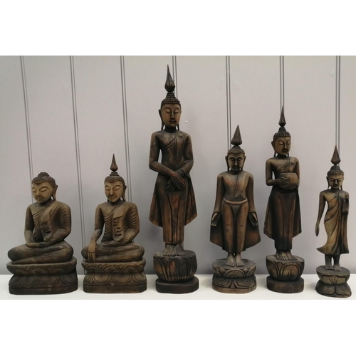 A collection of six carved Buddha figurines. Tallest 30cm.