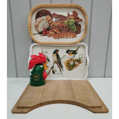 1498 - A selection of kitchenware. To include two decorated trays, wooden sink topper/chopping board & an u... 