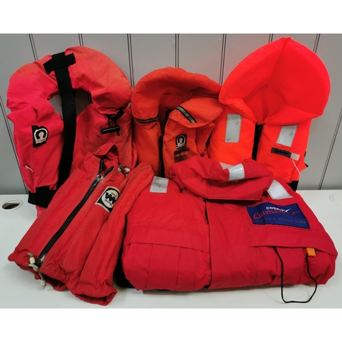 1528 - A selection of five items of aqua gear. To include four life jackets & a waterproof full-length suit... 