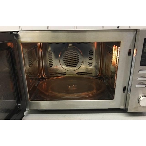 1561 - A stainless-steel Sharp microwave. model no. R-82STM-A. PAT test pass & functionality test indicates... 