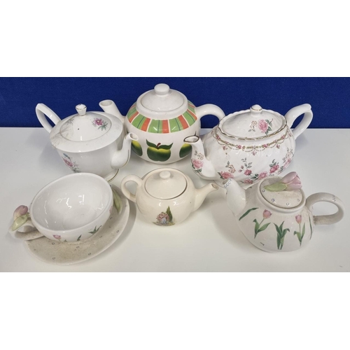 557 - A collection of teapots. Five examples in pastel tones. Includes a 'Royal Albert' 'Cosmos, October' ... 