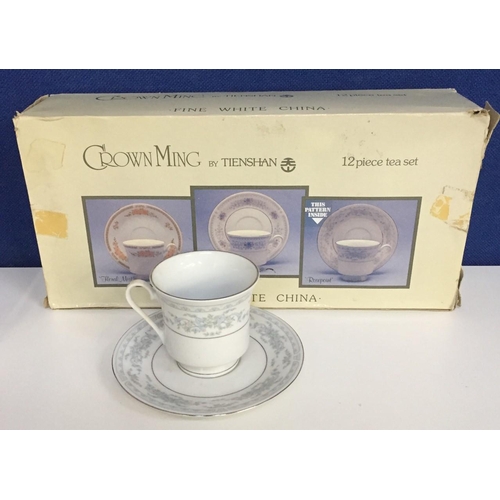 571 - A Tienshan Crown Ming 12 piece 'Rosepoint' tea set, in original box.