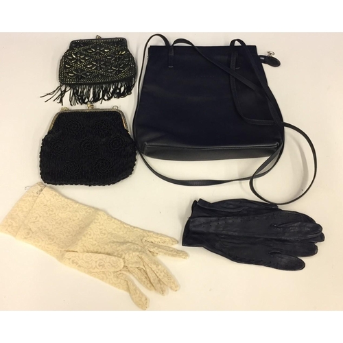 644 - A Le Torri leather handbag, 2 evening purses & 2 pairs of gloves (one leather & one vintage lace).