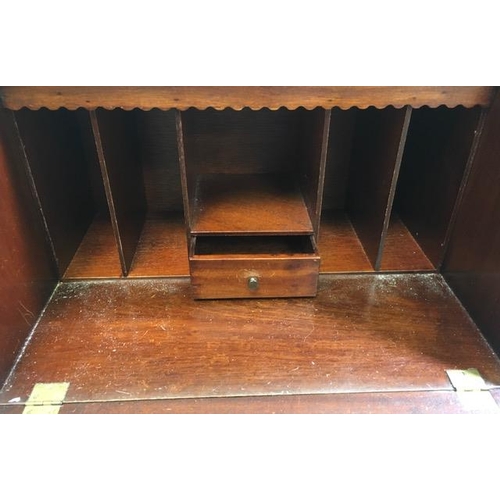 106 - An early 20th century, mahogany writing bureau. Fall-front reveals a leather writing insert & partia... 