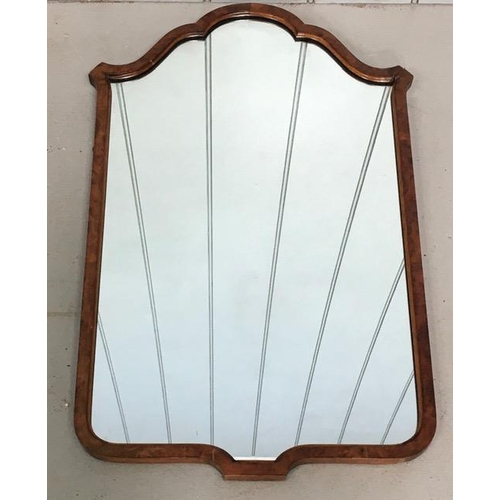 172 - An early 1900's walnut framed/scalloped edged mirror. Dimensions(cm) H71, W43.