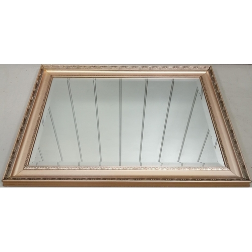 186 - A large, bevelled-edged wall mirror, with rose gold-coloured frame.  Height 64cm, width 90cm.