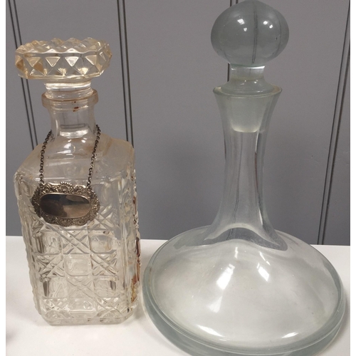 248 - A cut glass spirit decanter, together with a ship's decanter. Height 26cm/28cm.