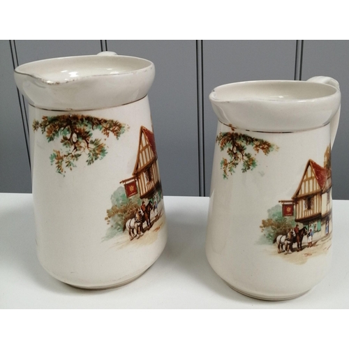 254 - A pair of graduated whiskey jugs, by 'Falcon Ware', each depicting a country inn scene. Height 17cm ... 