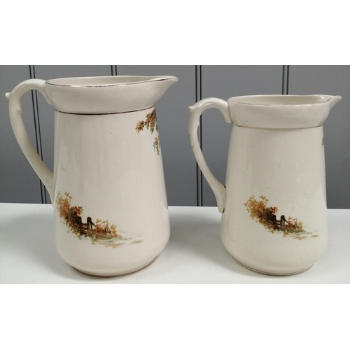 254 - A pair of graduated whiskey jugs, by 'Falcon Ware', each depicting a country inn scene. Height 17cm ... 