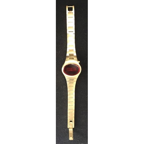 387 - A 1970's ladies LED watch, by 'Optim'. Gold-coloured. Case stamped '76040428'. Untested.