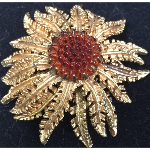 411 - Two, vintage 'Sarah Cov.' items. To include a sunflower gold-plated brooch, together with a cluster ... 