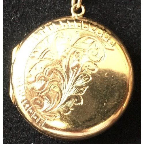 421 - A vintage, 9ct gold, engraved locket. Hallmarked to rear, weight approx. 4.5g. Complete with a yello... 