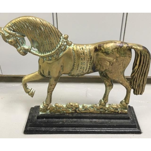 427 - A pair of 19th century, cast brass door stops. Each formed as a horse, on a stepped base. Dimensions... 