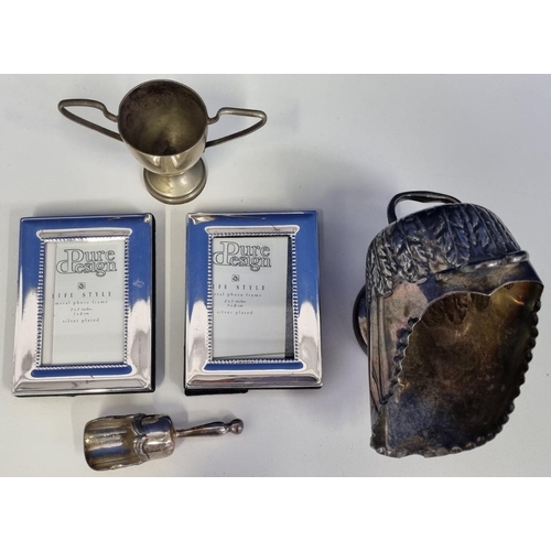 435 - A collection of silver plated items, to include a miniature scuttle with scoop, a trophy cup dated 1... 