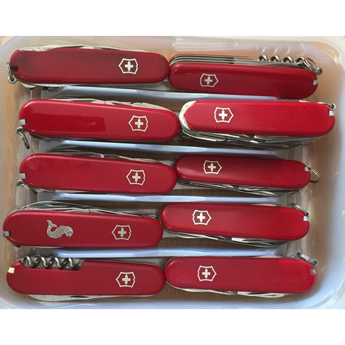 454 - A collection of ten red, Swiss Army knives.