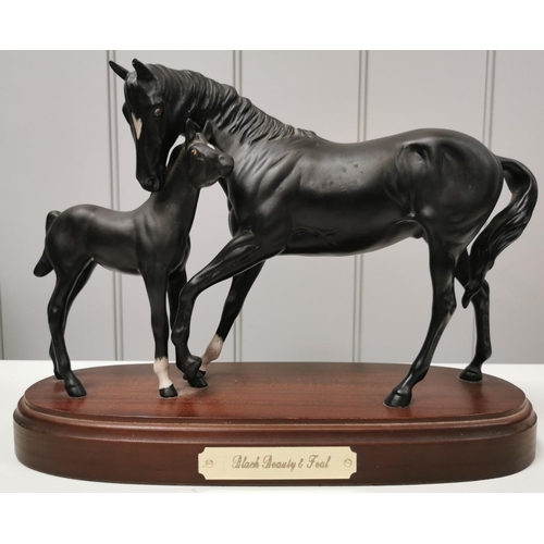 500 - A boxed 'Royal Doulton - Black Beauty with foal' figurine. Dimensions(cm) H22, W30, D12.