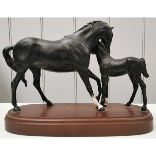 500 - A boxed 'Royal Doulton - Black Beauty with foal' figurine. Dimensions(cm) H22, W30, D12.