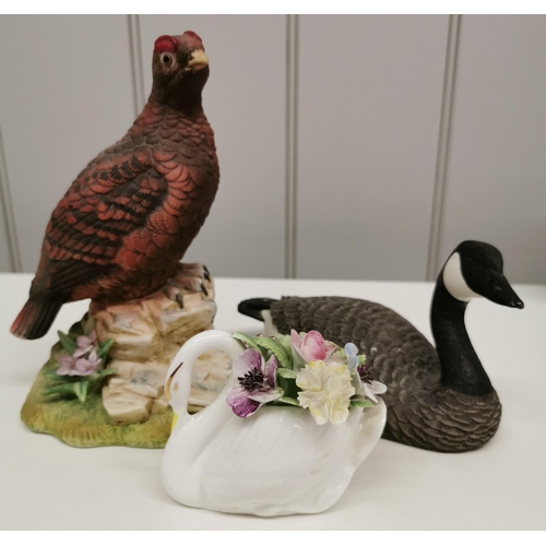 520 - A collection of three ornamental birds. To include 'Royal Doulton' Swan; 'Heritage Decoys' Canada Go... 