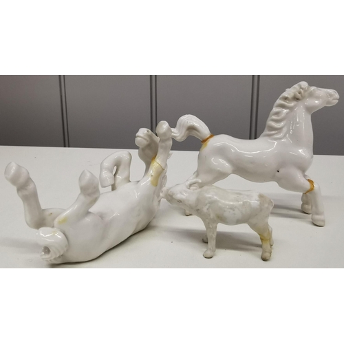 524 - A collection of eight white porcelain horses & two Oxen. Some damage to three horses & evidence of r... 