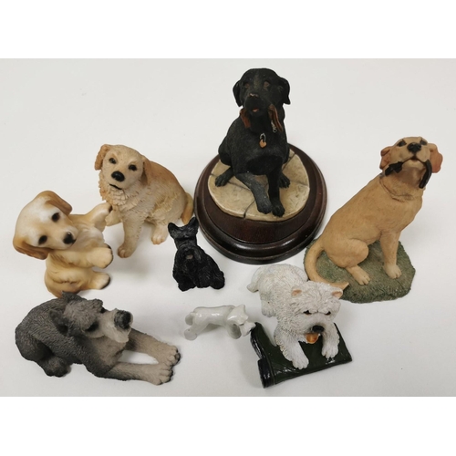 539 - A collection of eight ceramic dog figures.