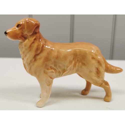 540 - Two ceramic dogs figures. The smaller being by 'Beswick' (with repair). Dimensions(cm) H17/8, W23/12... 