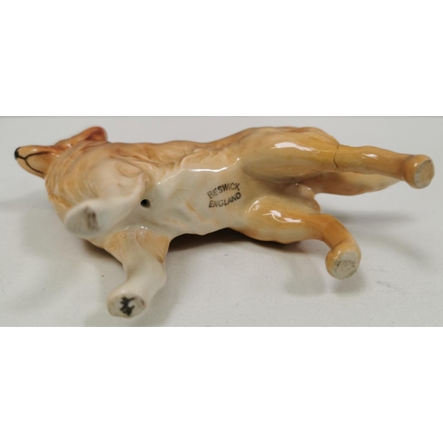 540 - Two ceramic dogs figures. The smaller being by 'Beswick' (with repair). Dimensions(cm) H17/8, W23/12... 