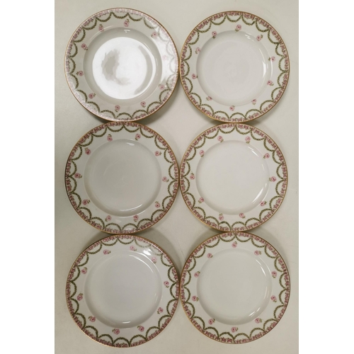 555 - A set of six 'Theodore Haviland' plates.  White with a gold rim, decorated with a pink rose & green ... 