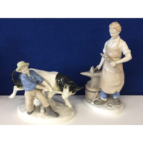 616B - Two good quality figurines. To include farmer with cow & blacksmith at anvil. Respective heights 18c... 