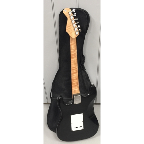 735 - A 'Burswood' six-string electric guitar, in black & cream. Complete with cover/case. Length 99cm.