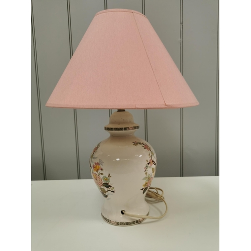 799 - A large, ceramic table lamp with pink & yellow flower detail & geometric border design. Complete wit... 