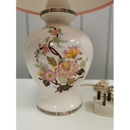 799 - A large, ceramic table lamp with pink & yellow flower detail & geometric border design. Complete wit... 