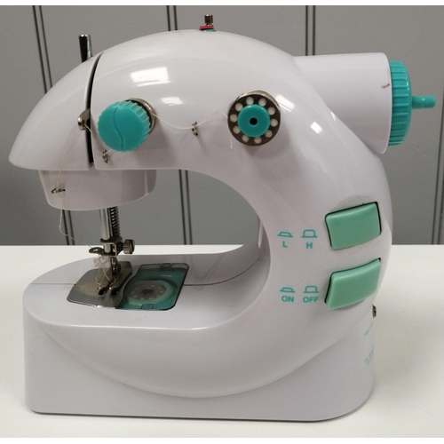 1566 - Easy Stitch portable mini sewing machine in original box, by 'JML'. Foot pedal & AC/DC adaptor not p... 