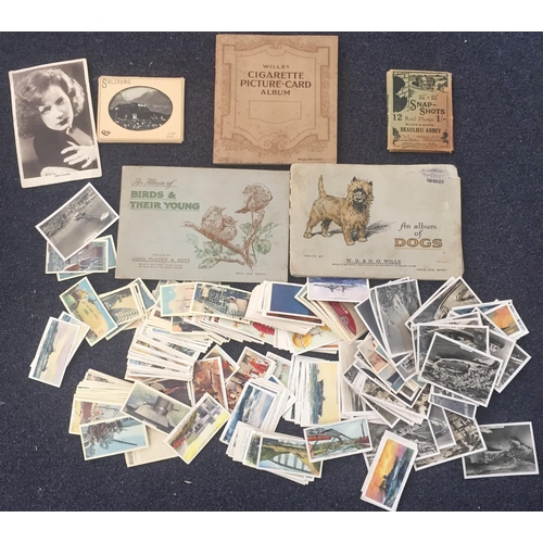 1601 - A collection of cigarette cards/albums & snapshots. To include Wills's cigarette album, Wills's 'An ... 