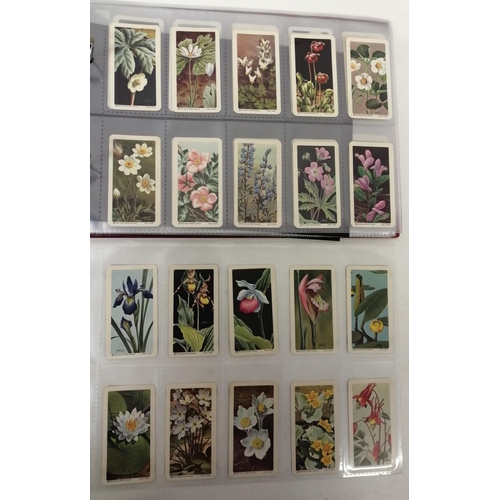 1607 - An album of Brooke Bond tea cards. To include ten sets: 'Animals & Their Young' - set of 48 cards; '... 