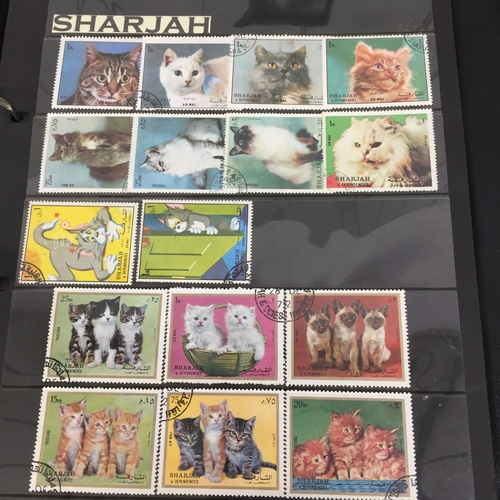 1626 - Two partially-completed stamp albums , with a 'Cats of the World' theme.