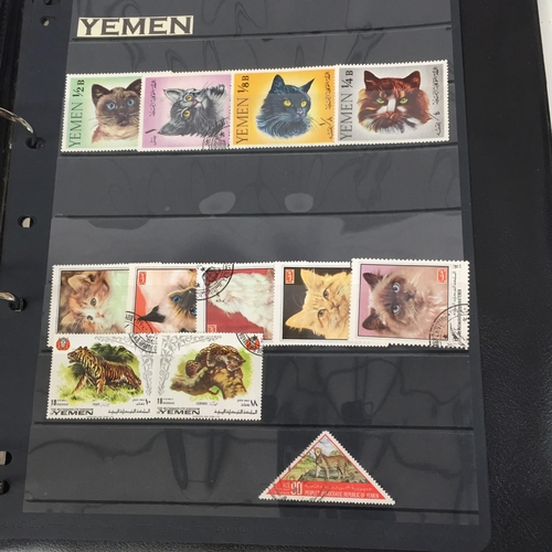 1626 - Two partially-completed stamp albums , with a 'Cats of the World' theme.