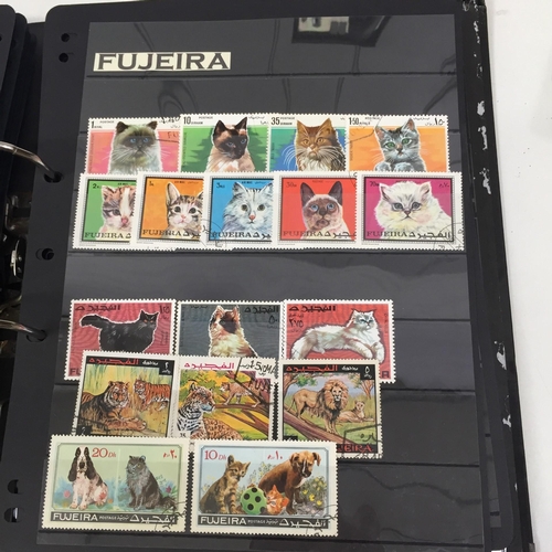 1626 - Two partially-completed stamp albums , with a 'Cats of the World' theme.