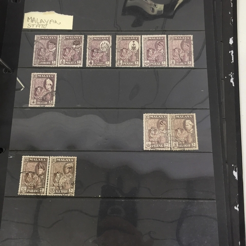 1626 - Two partially-completed stamp albums , with a 'Cats of the World' theme.