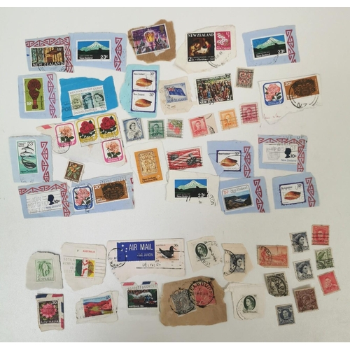 1631 - A very large collection of loose, worldwide stamps. Mostly mid-late 20th century.