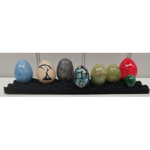 1392 - A collection of eight decorative eggs.