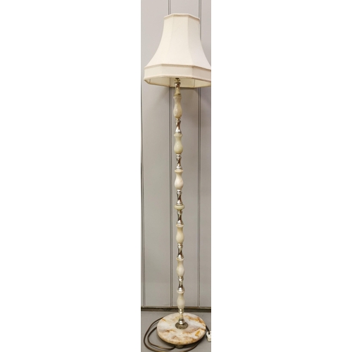 1562 - A tall, freestanding marble effect/brass lamp, with cream shade. PAT test failure as some damage to ... 