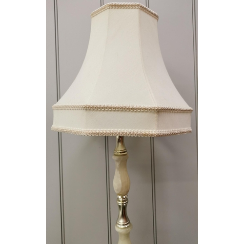 1562 - A tall, freestanding marble effect/brass lamp, with cream shade. PAT test failure as some damage to ... 