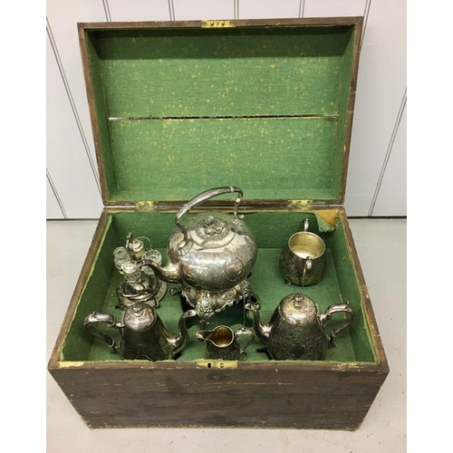 A superb, Victorian, silver-plated breakfast set, housed in an adapted wooden trunk. The set was made by James Dixon & Son, Sheffield & comprises of a kettle & burner stand, coffee pot, teapot, milk jug, sugar bowl & cruet set. Silver-plated tea/coffee pots in a wooden trunk. The kettle carries the inscription 'Presented to Mr W Smith by the Children & Teachers and Friends of St Mary's Church Boy's School in Appreciation of His 16 Years Kind & Faithful Services - April 1873'. Trunk dimensions(cm) H46, W63, D43.